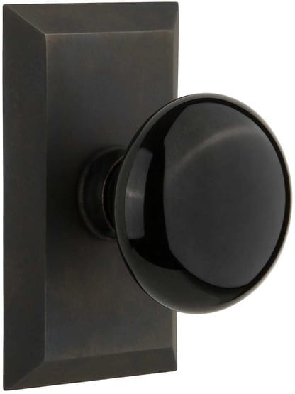 New York Rosette Door Set with Black Porcelain Knobs in Oil-Rubbed Bronze.